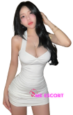 Woman in a white halter-neck mini dress